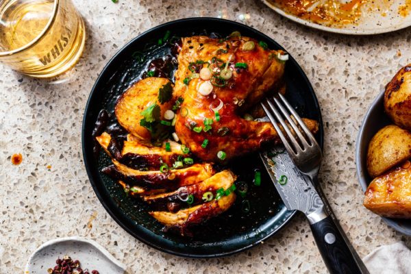 This 6 ingredient sheet pan dinner is your next weeknight rockstar: slightly spicy, slightly sweet Korean inspired chicken with creamy crispy roast potatoes #roastchicken #chicken #recipes #recipe #dinner #easy