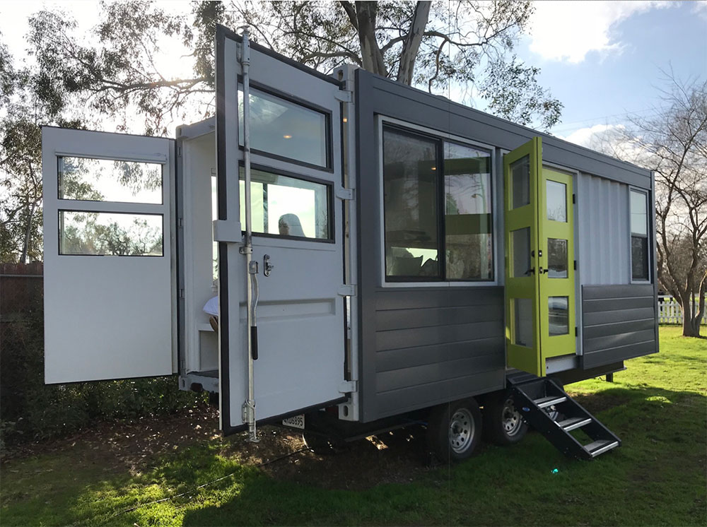 Shipping container home on wheels